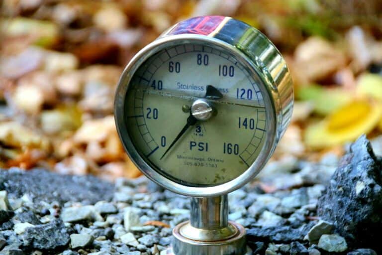 a close up of a pressure gauge on the ground; grace under pressure